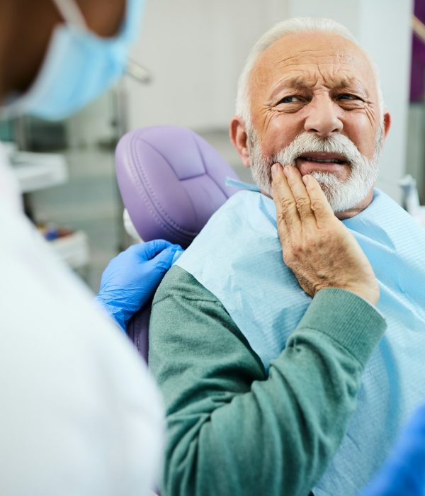 senior-man-complaining-about-toothache-to-his-dentist-at-dentist-s-office-.jpg senior-man-complaining-about-toothache-to-his-dentist-at-dentist-s-office-.jpg