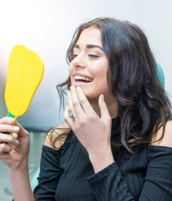 woman-looking-at-her-teeth.jpg